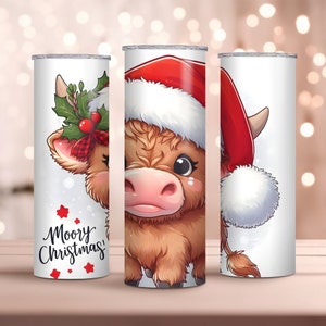 May include: Three stainless steel tumblers with a Christmas-themed design featuring a brown and white Highland cow wearing a red Santa hat. The tumbler on the left has the text "Moory Christmas!" in red and white lettering.