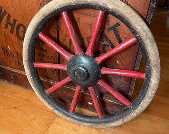 small old wooden wagon wheel