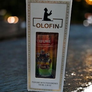 May include: A white box with gold trim and the word "LOLOFIN" in black. The box contains a perfume bottle with the word "PERFUME" and "7 Potencias" printed on it. The bottle is 3.38 oz.