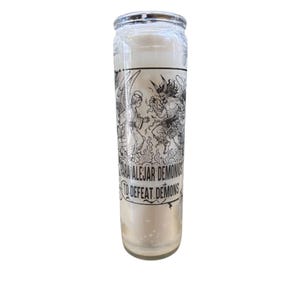 May include: White glass candle with a black and white illustration of an angel and a demon. The text on the candle reads "Para Alejar Demonios" and "To Defeat Demons".