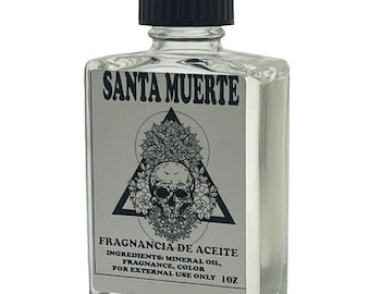 May include: A clear glass bottle with a black cap, labelled "SANTA MUERTE" and "FRAGNANCIA DE ACEITE". The label also includes the ingredients: mineral oil, fragrance, and colour. The bottle is for external use only and contains 10 fluid ounces.