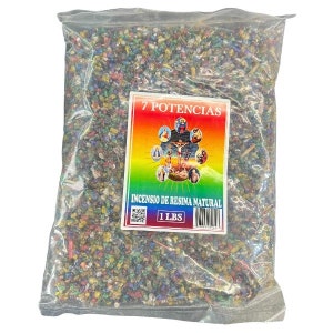 May include: A clear plastic bag filled with colorful resin incense. A rectangular label displays the text "7 Potencias" and "INCENSIO DE RESINA NATURAL". The label also features religious imagery and states the weight as 1 LBS.