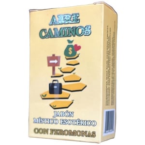 May include: A yellow box with the words "Abre Caminos" in blue and gold lettering. The box features a cartoon illustration of a staircase with a money bag, a heart, and a briefcase. The text "Jabón Místico Esotérico Con Feromonas" is printed in gold lettering.