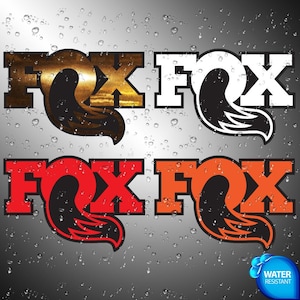 May include: Four different FOX logo designs. The top left logo has a sunset design, the top right is white with a black tail, the bottom left is red, and the bottom right is orange. The logos have a black tail design.