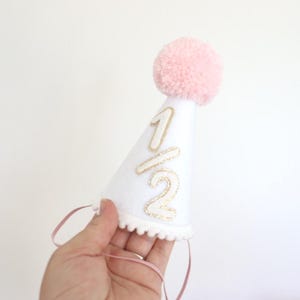Half Birthday Crown Baby Milestone Celebration Handmade Party Hat Glitter Design Headpiece Custom Color Options Festive Photo Prop Accessory Cake Smash Photography Essential Felt Material Construction Pom Pom Decoration Detail Elastic Strap