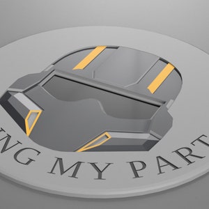 May include: A round, silver-colored pin with a gray and yellow helmet design and the text "I'M DOING MY PART".
