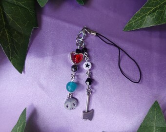 May include: A silver charm with a black cord, featuring a red heart, a white star, a blue bead, a skull charm, and a silver axe charm.