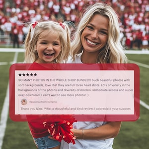 a woman holding a little girl in front of a football field