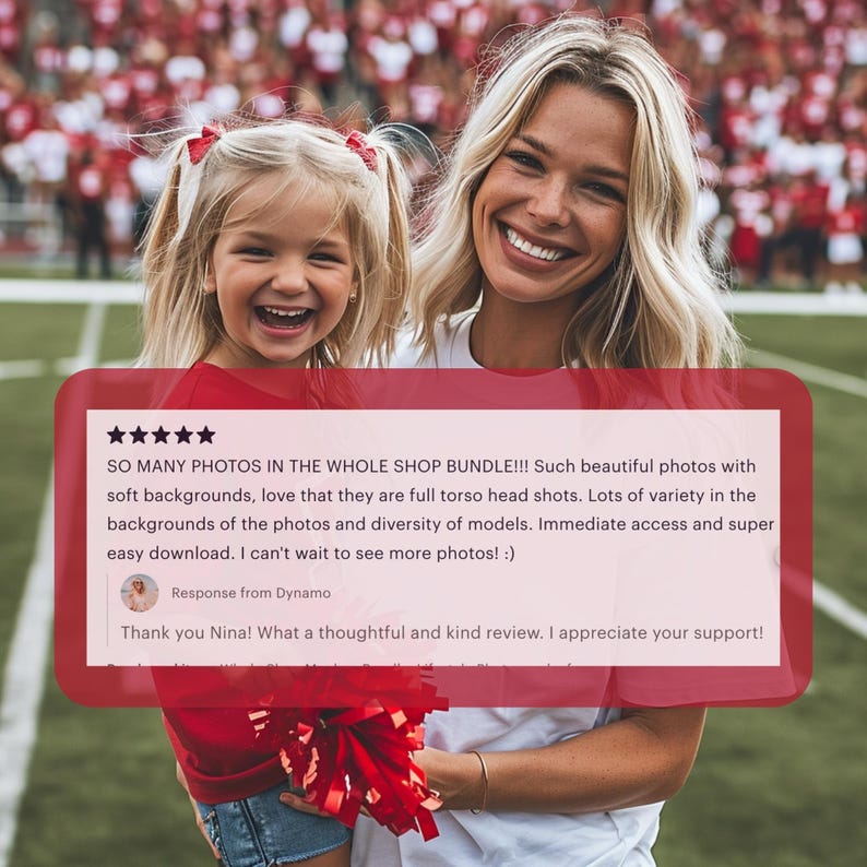 a woman holding a little girl in front of a football field