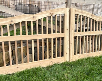 Outdoor cedar driveway gate with balusters