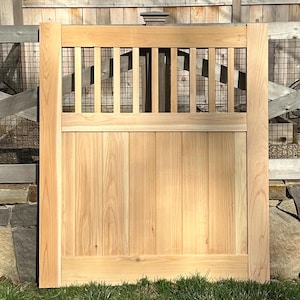 Flat rail outdoor cedar gate with solid panel