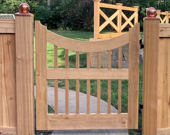 Scalloped outdoor cedar gate with balusters