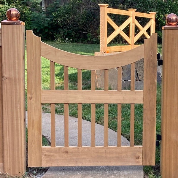 Scalloped outdoor cedar gate with balusters