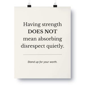 May include: A poster with the text "Having strength DOES NOT mean absorbing disrespect quietly. Stand up for your worth." The poster is cream-colored and held by two black binder clips.