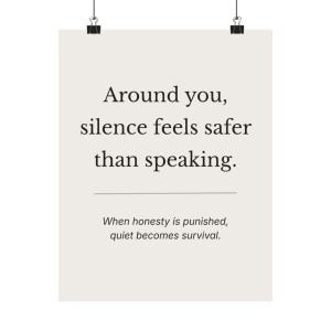 May include: A poster with the text "Around you, silence feels safer than speaking." and "When honesty is punished, quiet becomes survival." The poster is held by two black binder clips.