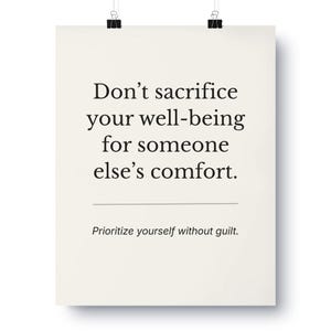 May include: A poster with the text "Don't sacrifice your well-being for someone else's comfort. Prioritize yourself without guilt." The poster is cream-colored and held by two black binder clips.