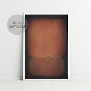 May include: Abstract art print with a brown and orange color scheme. The print is framed in a white frame and is hanging on a white wall.