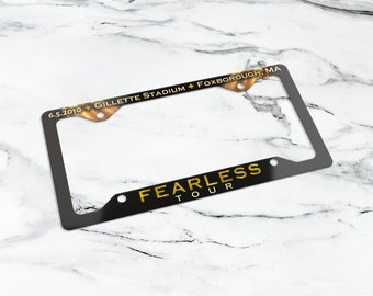 Fearless Tour license plate frame. Customizable aluminum license plate cover. Fearless Tour merch, car accessories.