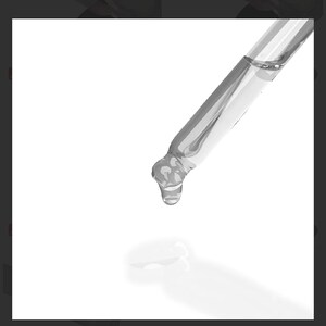 May include: A clear glass dropper with a liquid droplet suspended at the tip. The dropper is angled downwards, with a white background. The image highlights the precision of the tool.