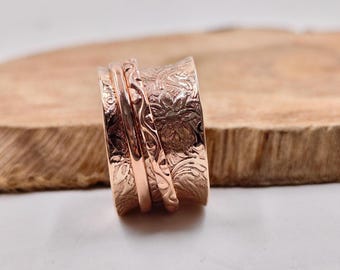 This handcrafted solid pure copper band features a distinctive textured finish and warm metallic sheen.