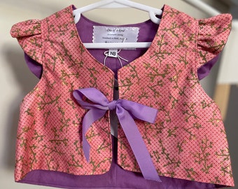 Reduced price: Size 0000 (new born) baby jacket with ribbon and ruffled cap sleeves