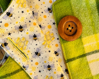 Handmade size 5 kid's green woollen vest, with bee lining