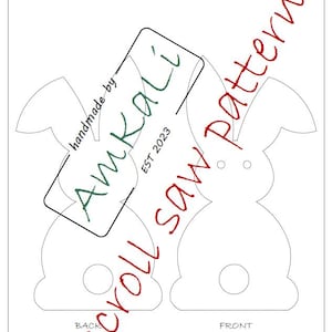 May include: A white paper scroll saw pattern featuring two bunny shapes, labeled "Back" and "Front". The pattern includes the text "Scroll saw pattern" and the AmKali logo, established in 2023.