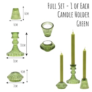 May include: A full set of green glass candle holders and candles. The set includes a variety of candle holders, including a 10cm tall candlestick, and candles. The text "FULL SET - 1 OF EACH CANDLE HOLDER GREEN" is visible.