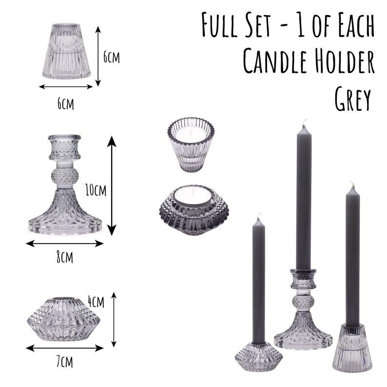 May include: A full set of grey glass candle holders and candles. The set includes a variety of holders, including a 10cm tall candlestick and a 6cm tall holder. The text "FULL SET - 1 OF EACH CANDLE HOLDER GREY" is displayed.