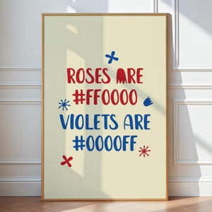 May include: A beige poster with a red and blue graphic design. The text reads "Roses are #FF0000 Violets are #0000FF".