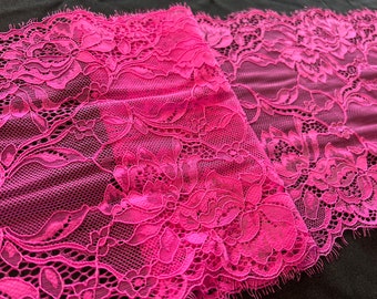 May include: Pink floral lace trim with a delicate pattern and scalloped edges.
