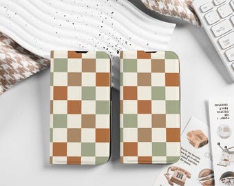 May include: Two phone cases with a checkered pattern in shades of brown, green, and white.