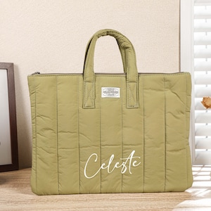 May include: A green quilted tote bag with a white logo and the word "Celeste" written in white script on the front.