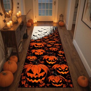 May include: A rectangular runner rug featuring a repeating pattern of orange jack-o'-lanterns with glowing eyes and mouths against a black background, with a cluster of flying black bats at the top edge, creating a dense, dark, and festive seasonal display.