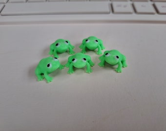 100 mini frogs