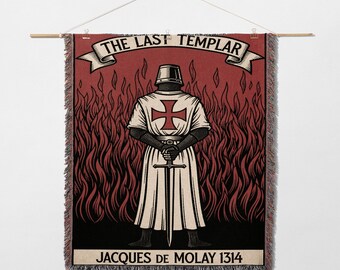 May include: A woven wall hanging featuring a graphic of a Templar knight with a sword, set against a red background of flames. The banner reads "THE LAST TEMPLAR" and "JACQUES DE MOLAY 1314". The artwork is in black, red, and white.