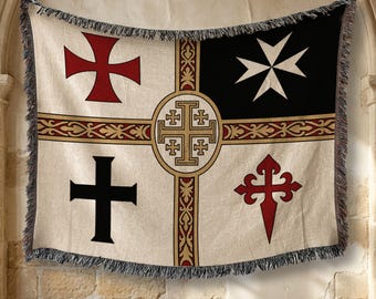 May include: A woven throw blanket featuring a central gold Jerusalem cross emblem within a circle, surrounded by four distinct quadrants. The design includes a red cross, a white Maltese cross on black, a black cross, and a red Santiago cross.