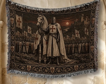 May include: A woven tapestry blanket featuring a medieval knight in armor and a cape standing beside a horse. The scene includes a line of soldiers with shields, flags with red crosses, and a castle in the background under a dark, moody sky.