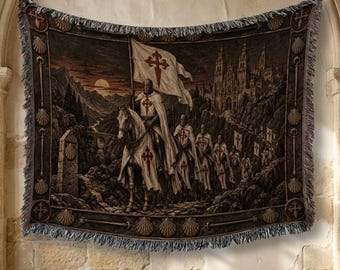 May include: A woven tapestry blanket featuring a procession of knights on horseback carrying white flags with red crosses. The scene includes a large stone cathedral in the background, a mountain landscape at sunset, and a border decorated with scallop shells.