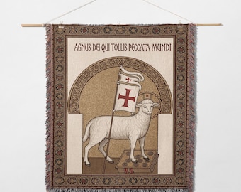 May include: Woven wall hanging featuring a lamb holding a flag with a red cross, standing on a book. The text "AGNUS DEI QUI TOLLIS PECCATA MUNDI" is at the top. The border has a geometric pattern in brown and red.