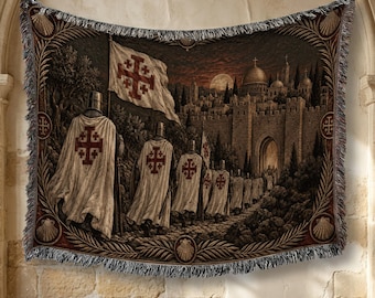 May include: A woven tapestry blanket featuring a line of knights in white cloaks with red Jerusalem crosses, walking toward a stone city gate under a moonlit sky. The border is decorated with a leaf pattern and shell motifs at the corners.