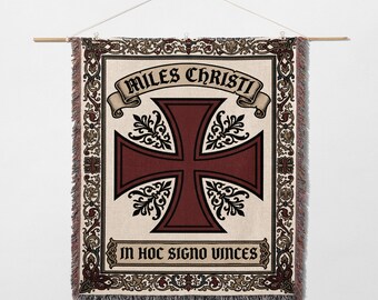 May include: Woven wall hanging featuring a burgundy Maltese cross design with the text "MILES CHRISTI" and "IN HOC SIGNO VINCIS". The tapestry has a cream background with decorative borders and fringe.