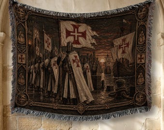 May include: A woven tapestry blanket featuring a group of knights in armor wearing white cloaks with red crosses. The scene depicts knights standing on a stone dock near a sailing ship at sunset, with a decorative border containing nautical motifs.