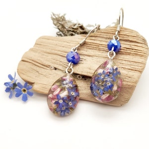 Resin earrings with real flowers. Dried forget-me-not and heather flowers. Dangle earrings with 925 silver hooks. Naturalistic jewelry