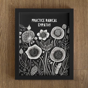May include: Black and white framed print with the text "Practice Radical Empathy" and a floral design.