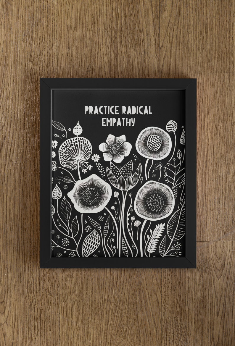 May include: Black and white framed print with the text "Practice Radical Empathy" and a floral design.