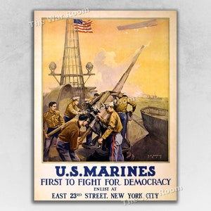 May include: A vintage World War I era recruitment poster for the U.S. Marines. The poster features a group of men manning a large gun on a ship. The poster reads "U.S. Marines First to Fight for Democracy Enlist at East 23rd Street, New York City."