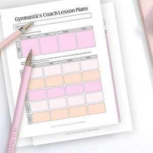 May include: A stack of white Gymnastics Coach Lesson Plans with pink and peach-colored boxes. Two pink pens are on the pages. The text "IS IT FRIDAY" is on one pen. The text "Gymnastics Coach Lesson Plans" is at the top of the page.