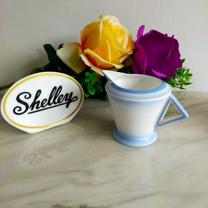 The art deco design here is a creamer or jug by Shelley in the stylish and elegant Eve Shape.