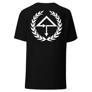 May include: Black t-shirt with a white graphic of a stylized arrow design inside a laurel wreath.